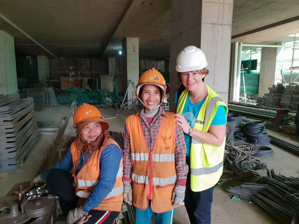 Karen Britton meeting the women responsible for steel bar bending on a construction site in Phnom Penh, Cambodia