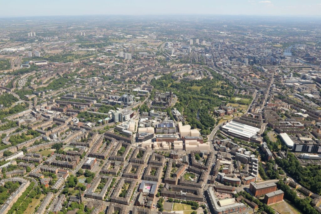 An aerial image of Glasgow showing the completed, in-design and future buildings of the University of Glasgow